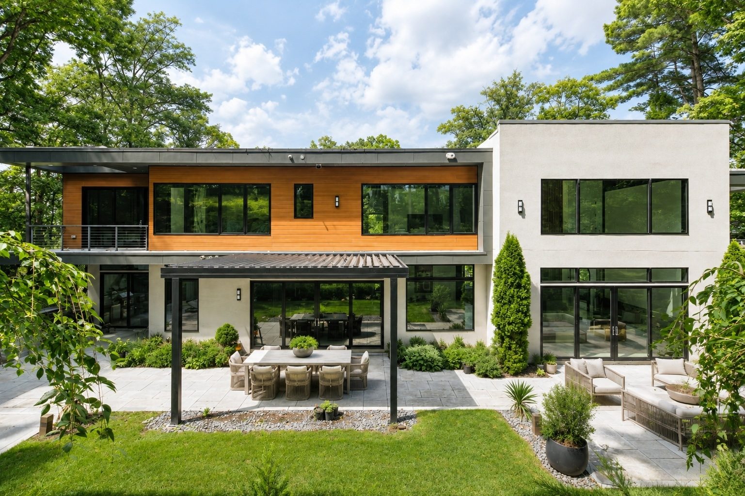 rear lawn and bluestone terrace at 15 Seminole Way beneath a mature tree canopy