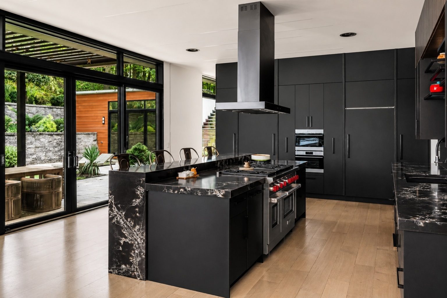 eat-in kitchen at 15 Seminole Way with matte black cabinetry and a marble waterfall island